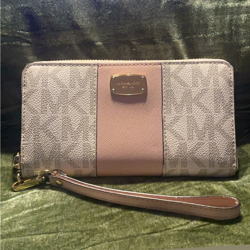 Michael Kors white & pink zip up wallet . Lightly used .